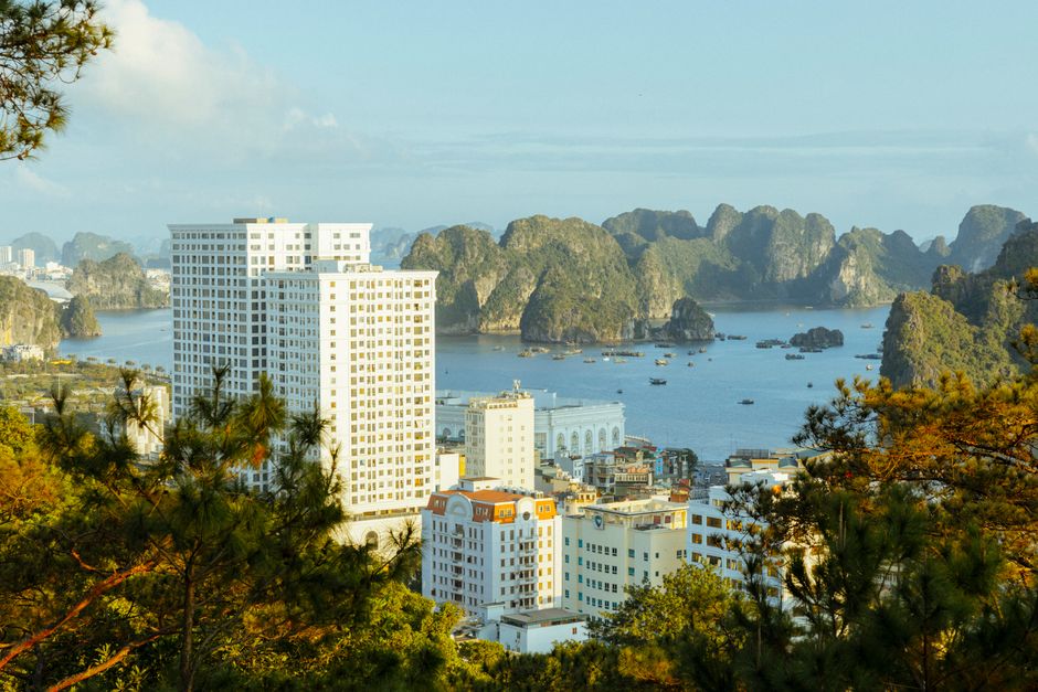 Beautiful Ha Long Bay with cityscape and karst formations in Vietnam, a UNESCO World Herit