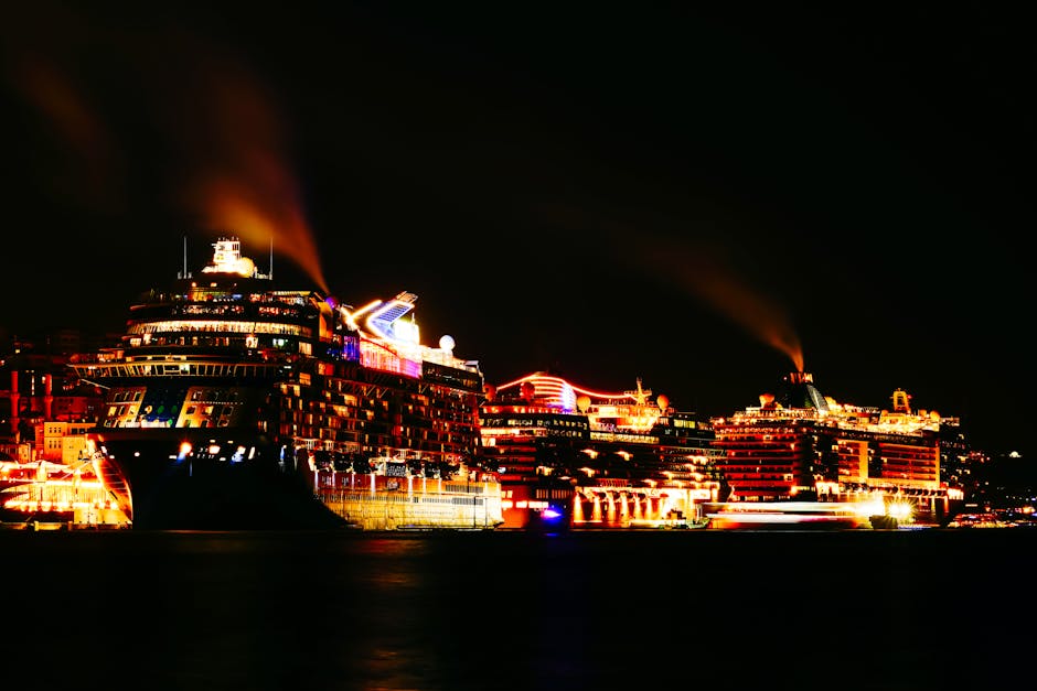Cruise ships beautifully illuminated in İstanbul harbor, providing a picturesque night view.