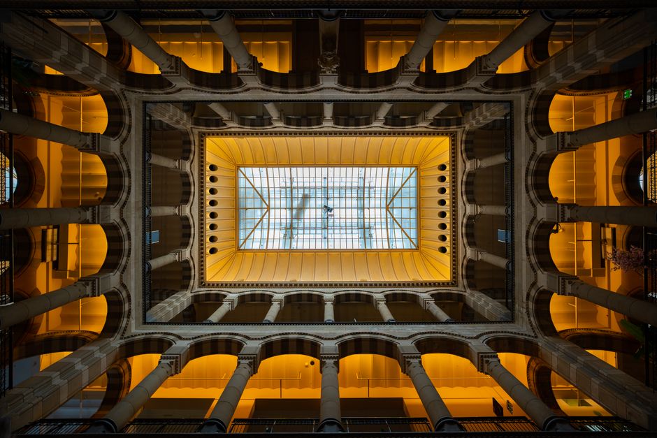 Elevated view of a magnificent architecture dome lit with warm lighting in Amsterdam.