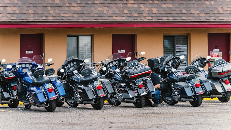 Several touring motorcycles parked in front of a motel in Williams, Arizona, along Route 66.