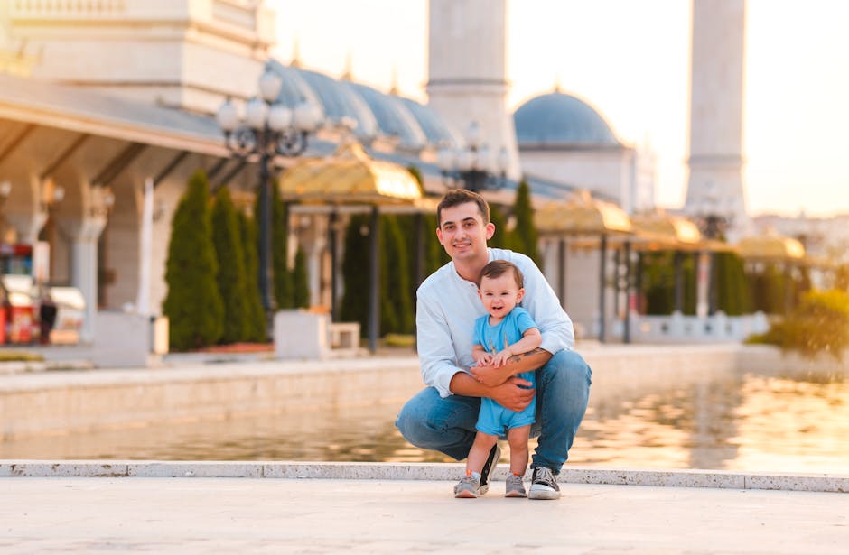 Father and child smiling by the pool in Ankara, Türkiye at sunset.