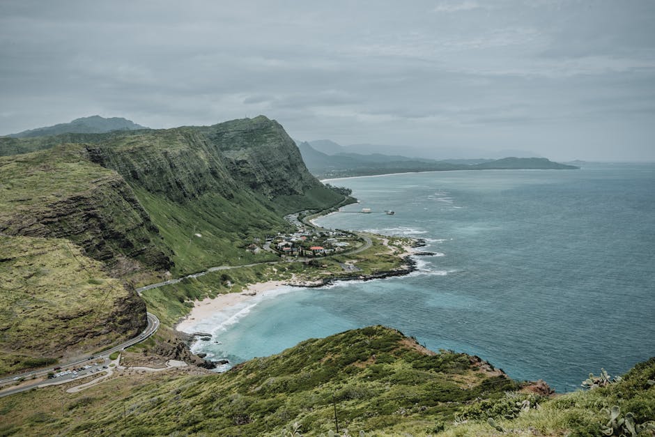 Explore the breathtaking cliffs and azure waters of Oahu's coastline in this scenic aerial view.