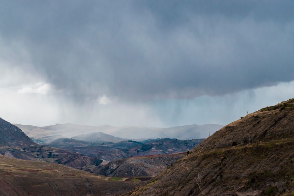 Vibrant Andean landscape in Jauja, Peru with dramatic cloud formations and rugged mountain
